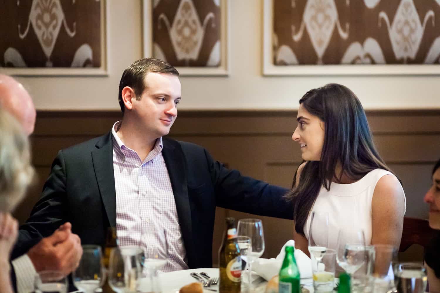 Couple talking at table at a Hoboken rehearsal dinner
