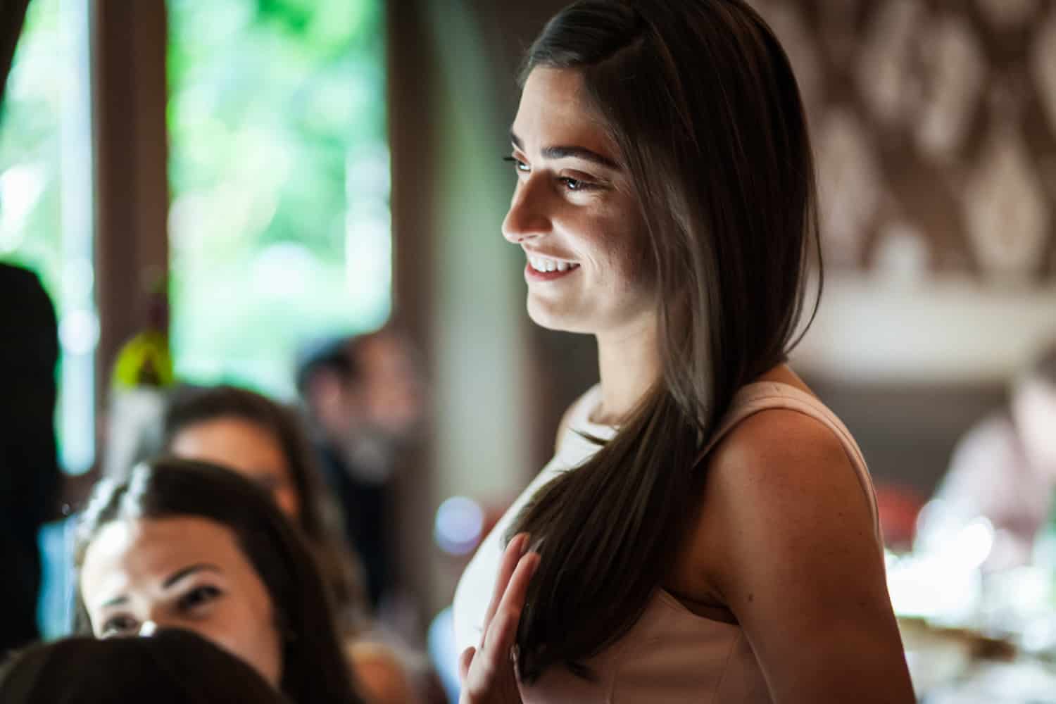 Bride-to-be visiting with guests at a Hoboken rehearsal dinner