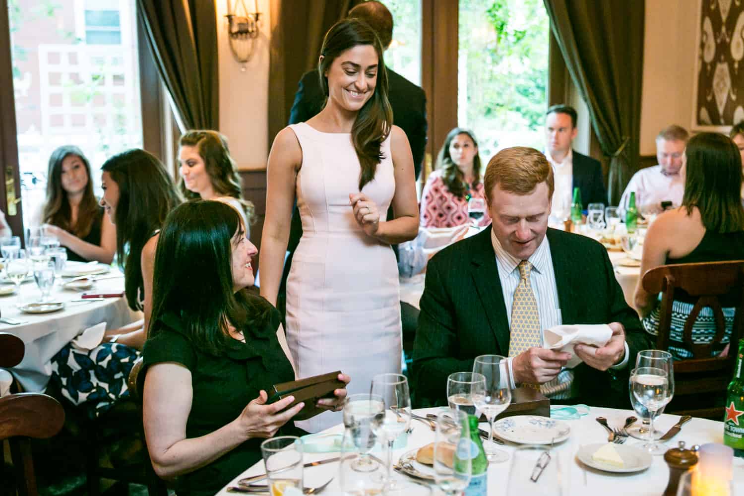 Bride to be giving gifts at a Hoboken rehearsal dinner