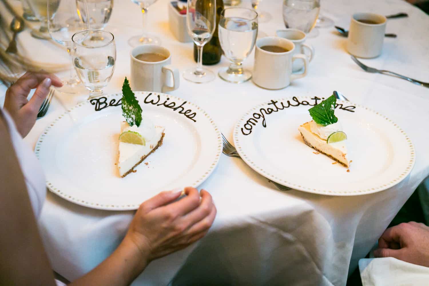 Two plates of key lime pie with writing in chocolate