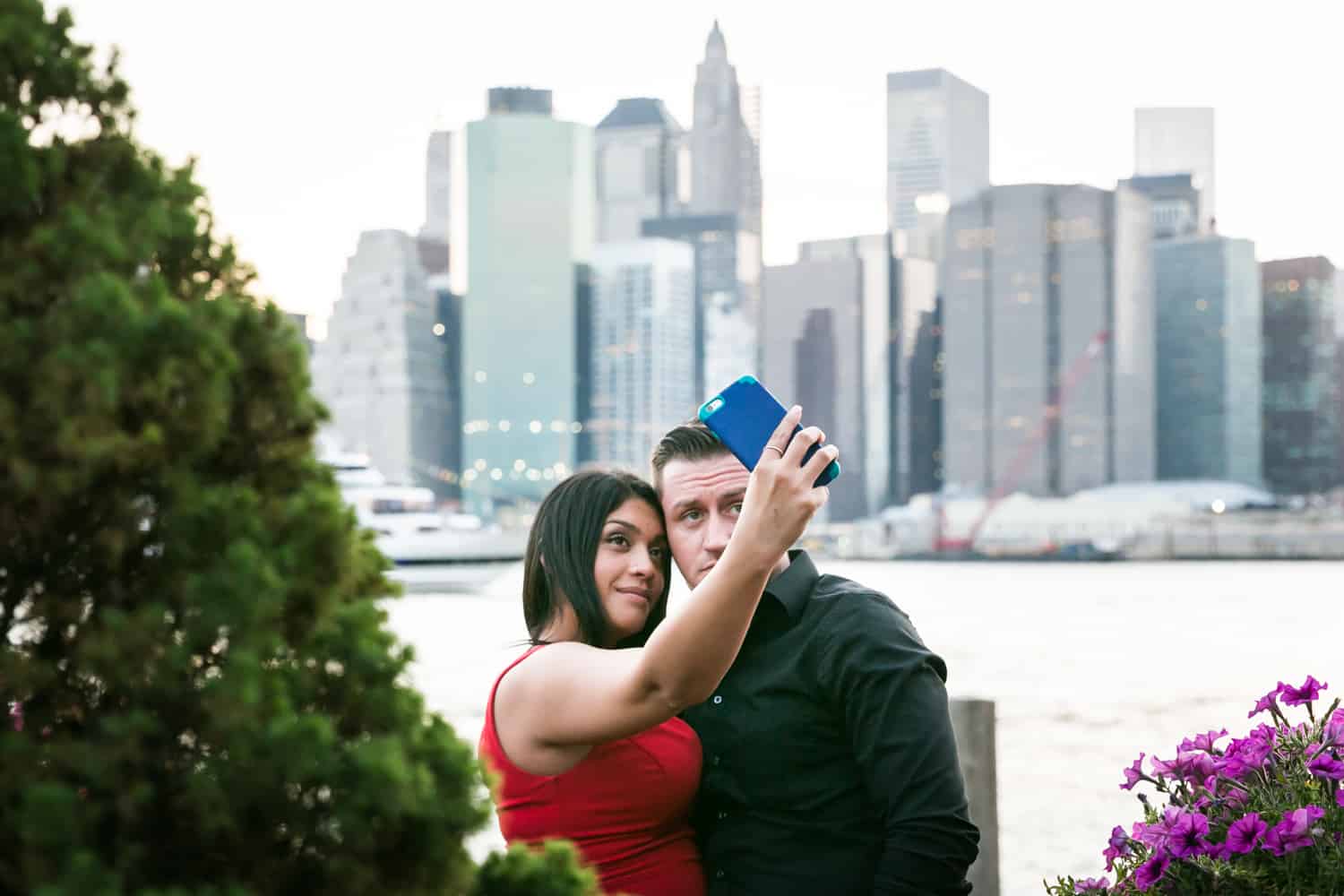 Couple taking a selfie outside at a River Café wedding in Brooklyn