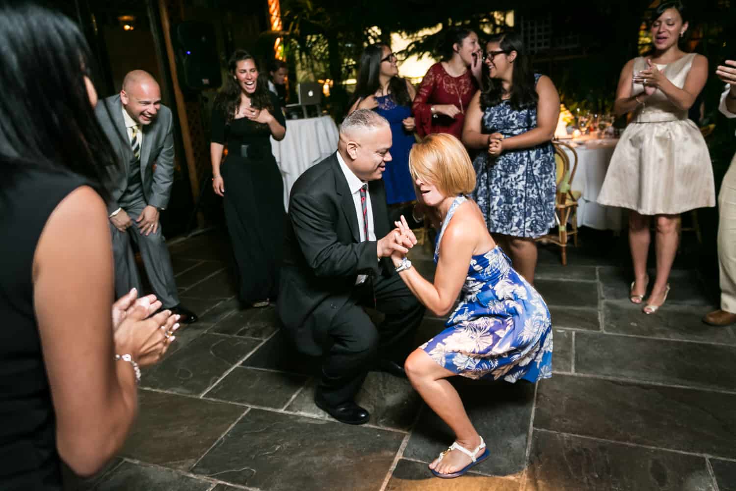 Couple dancing low to floor at a River Café wedding in Brooklyn