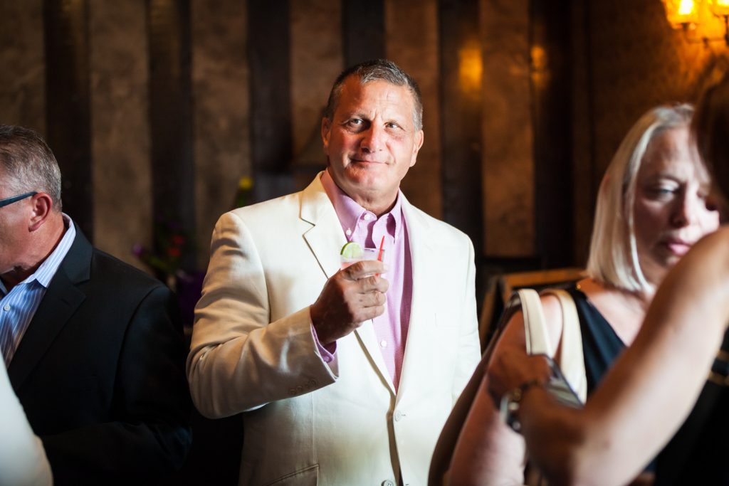 Man wearing white jacket at a Bell House wedding anniversary party