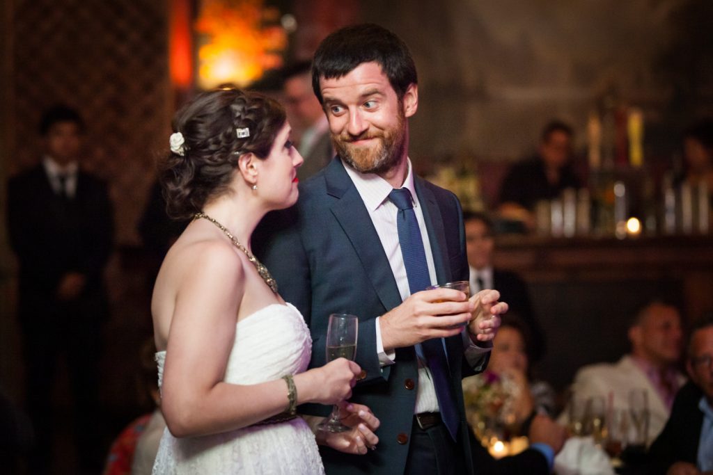 Groom making a funny face to bride at a Bell House wedding anniversary party