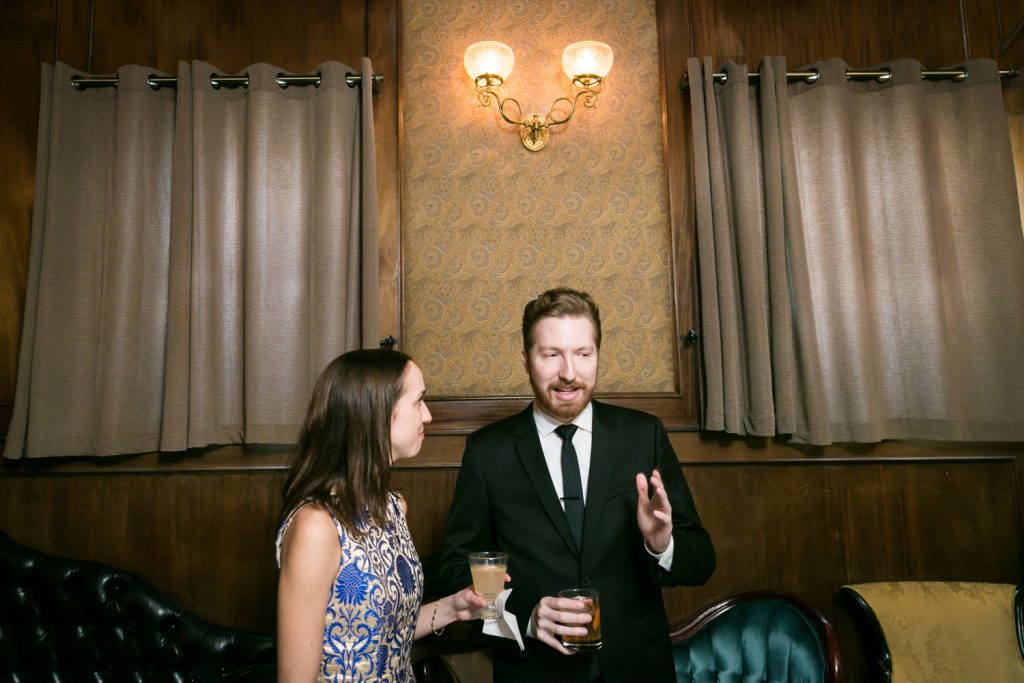 Groom talking with female guest at a Clover Club wedding