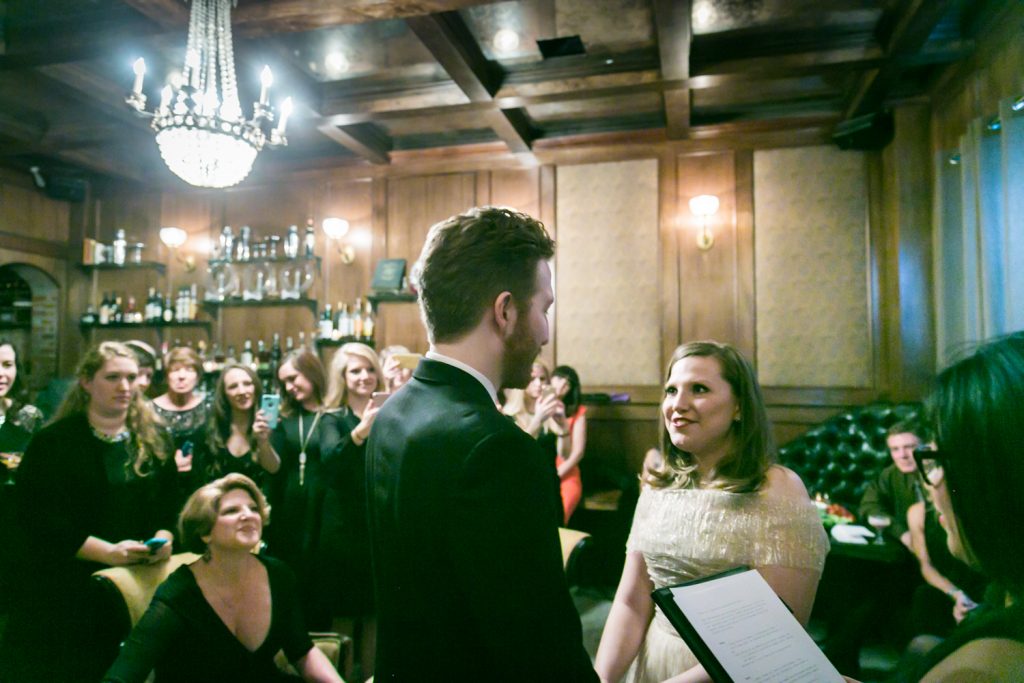 Bride and groom exchanging vows during ceremony at a Clover Club wedding