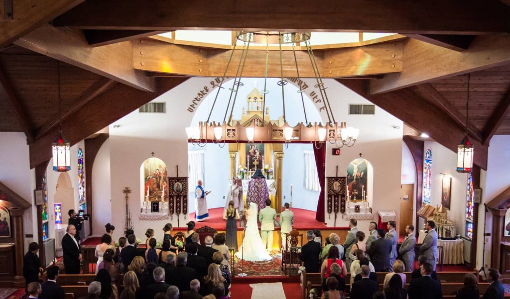 Wide shot of Eastern Orthodox wedding ceremony