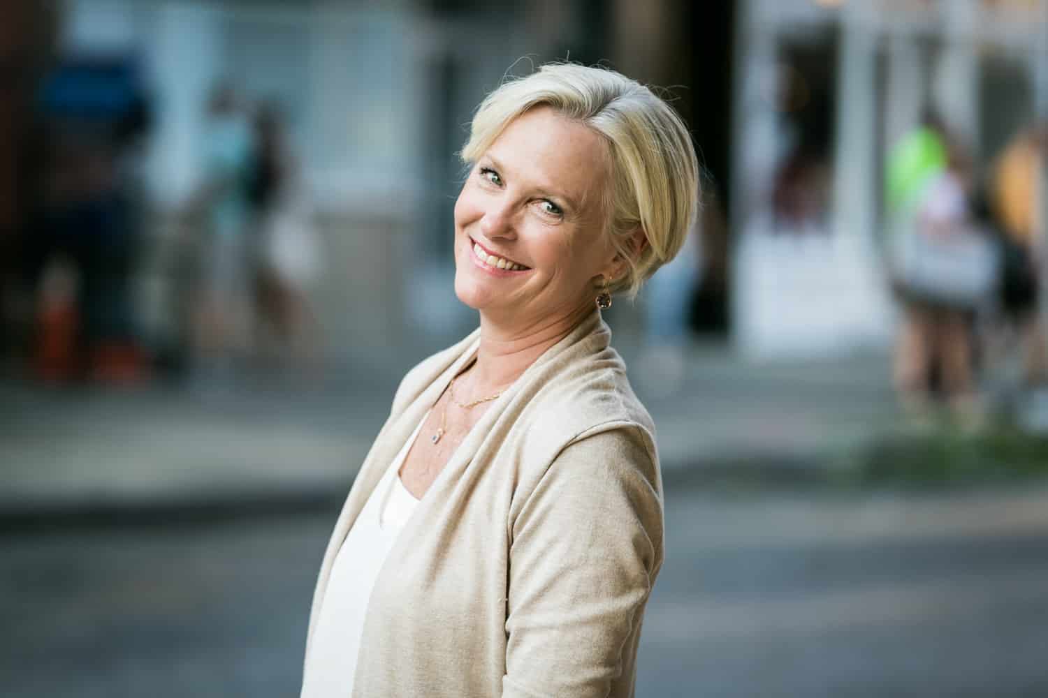 Older woman with short blond hair photographed during golden hour