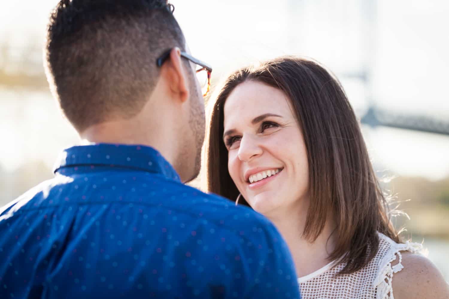 Woman looking at man during an Astoria Park engagement shoot