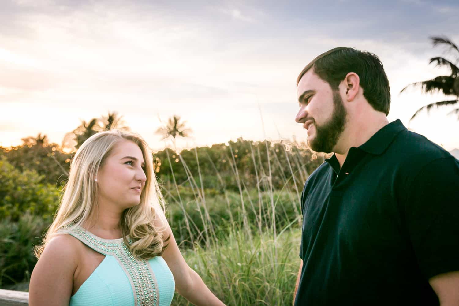Couple looking at each other during a Coral Cove Park engagement shoot