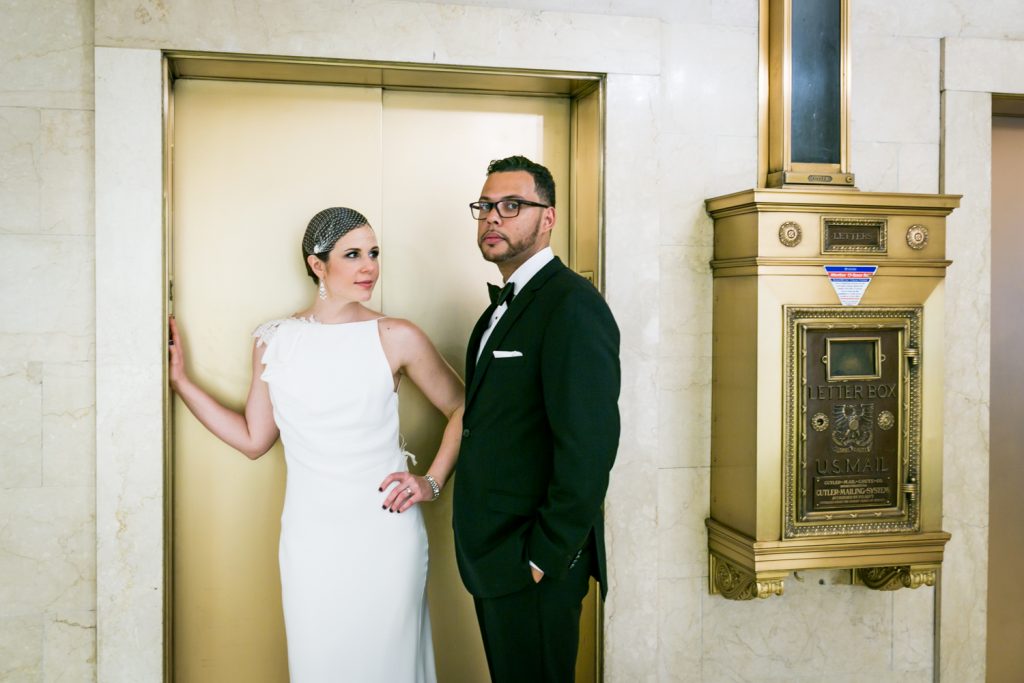 Bride looking at groom outside of elevator in Roosevelt Hotel wedding photo