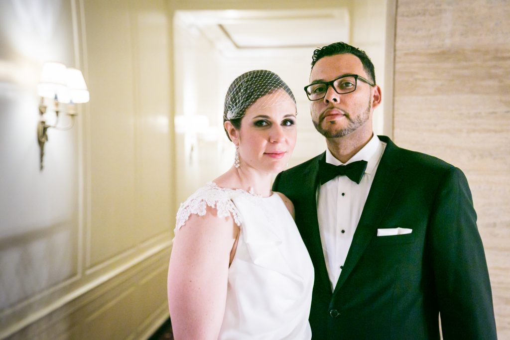 Portrait of bride and groom in hotel hallway in Roosevelt Hotel wedding photo