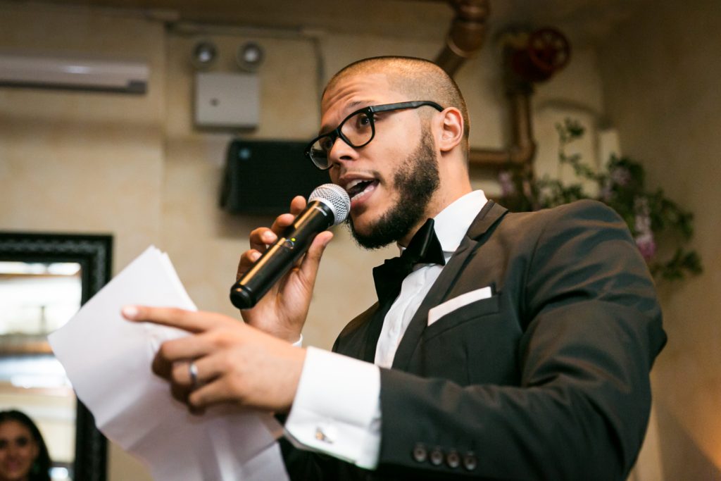 Best man making speech at wedding reception
