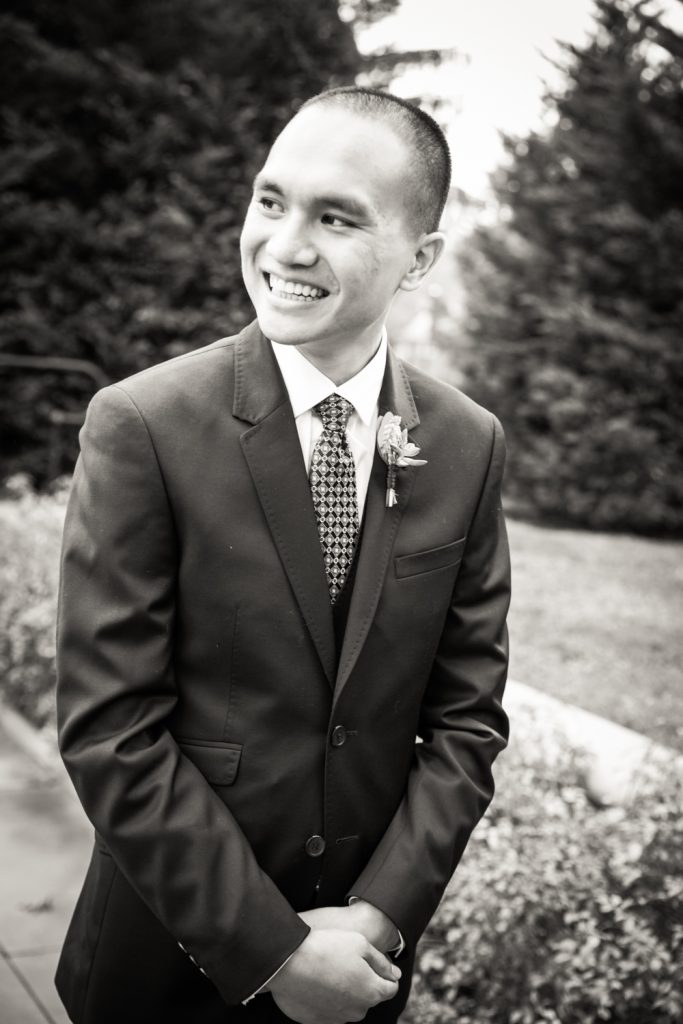 Black and white photo of groom waiting for bride at a Snug Harbor wedding