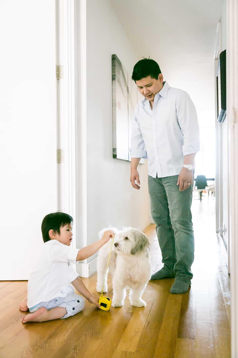 Chelsea family portrait of little boy measuring dog
