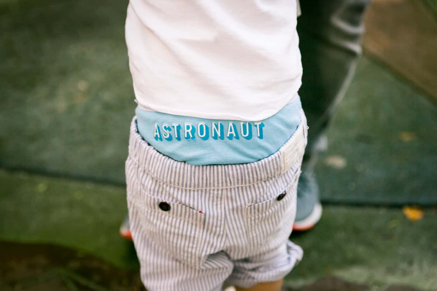 Close up on little boy wearing 'astronaut' underwear