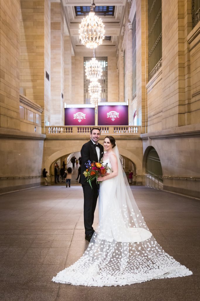 Portrait of bride and groom in Grand Central Terminal