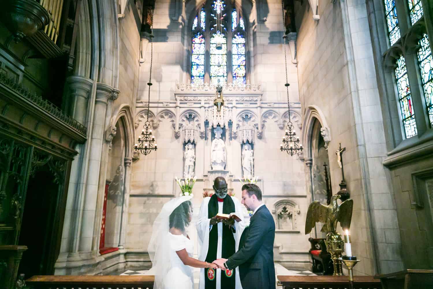 Bride and groom exchanging vows in a Trinity Church wedding