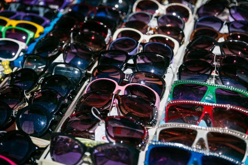 Sunglasses for sale lined up on a table