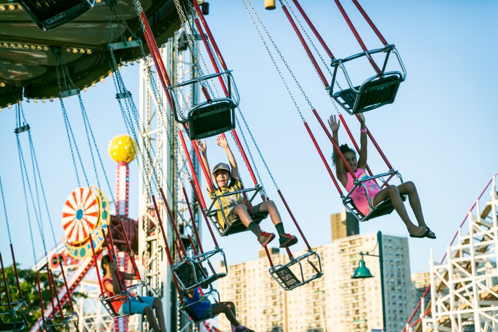 People riding carnival ride in Coney Island, Brooklyn