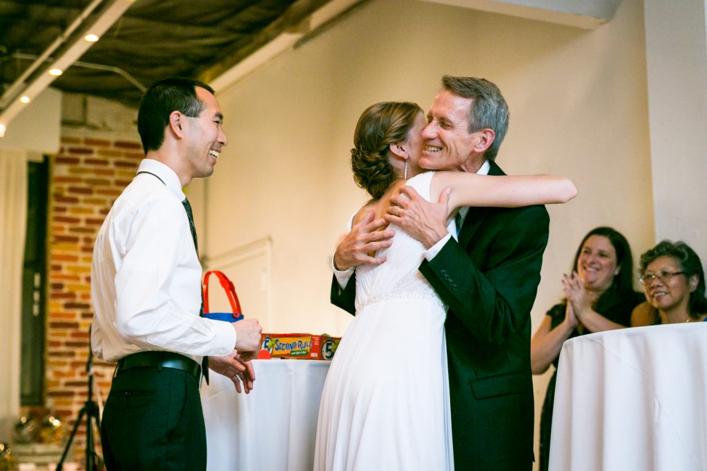 Bride hugging father after speech at Astoria wedding reception