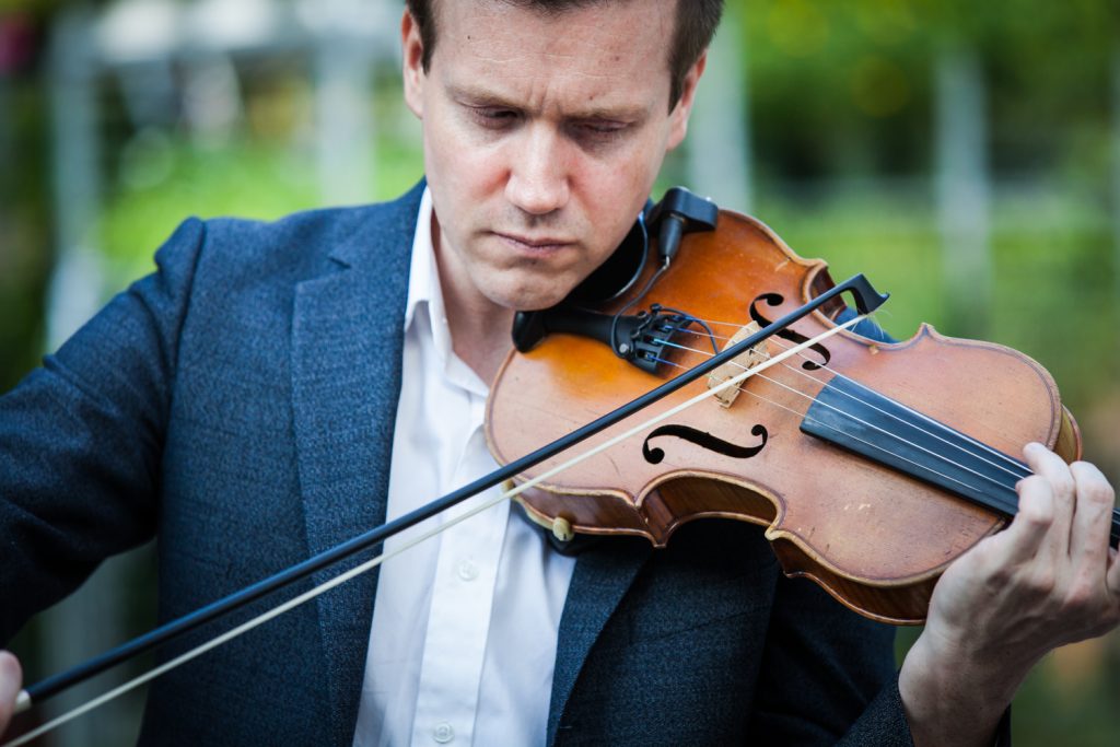 Close up of man playing violin