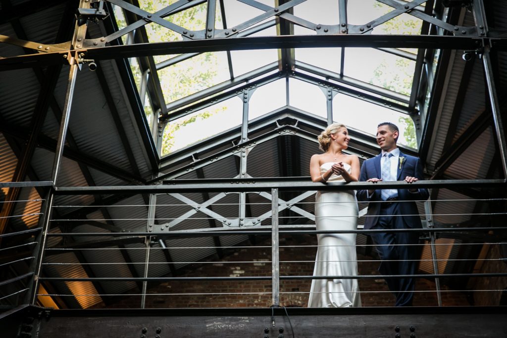 Bride and groom on mezzanine level for an article on how to become a wedding officiant in NYC