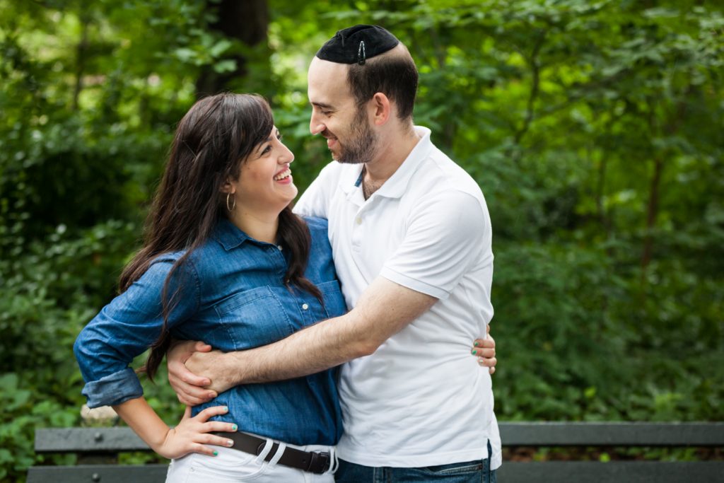 Couple hugging and looking at each other in Prospect Park