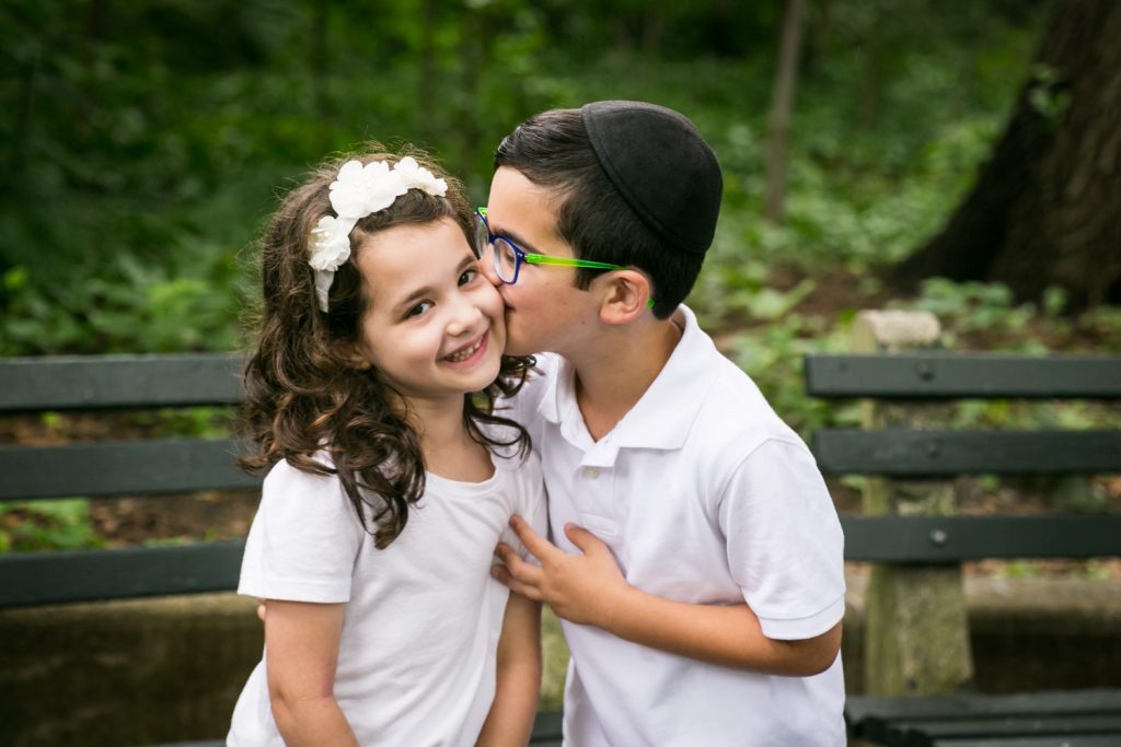 Little boy kissing little girl in Prospect Park