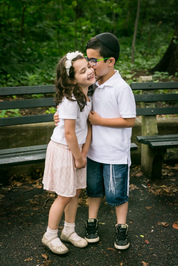 Little boy kissing little girl in Prospect Park