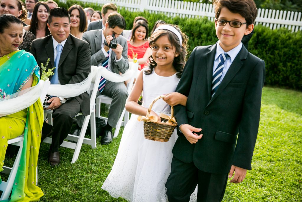 Flower girl and young boy walking down aisle at Highlands Country Club wedding ceremony