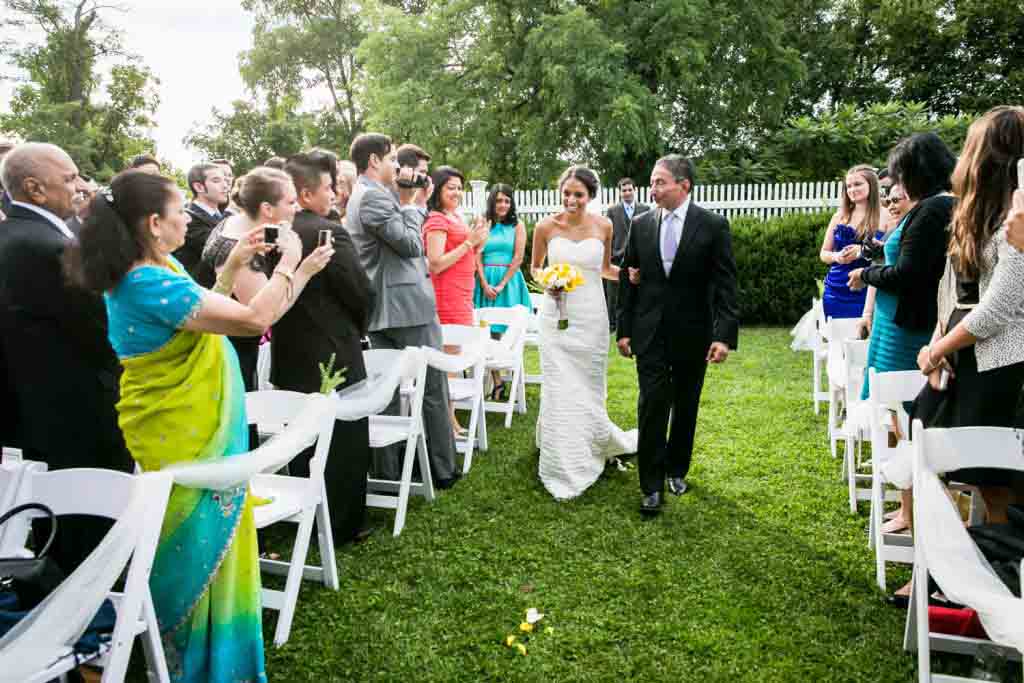 Bride walking down aisle at Highlands Country Club wedding ceremony