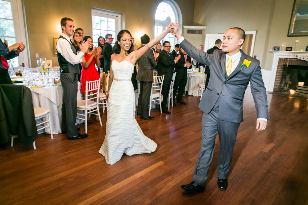 Bride and groom entering reception at Highlands Country Club wedding ceremony