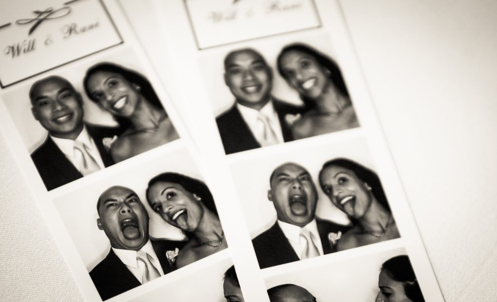 Black and white photo of photobooth strip of bride and groom making funny faces