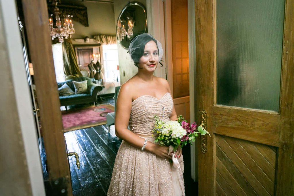 Bride holding bouquet in doorway at a 632 on Hudson wedding