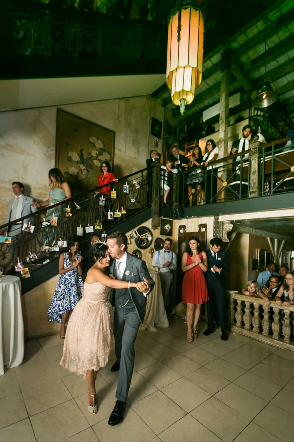 Bride and groom dancing at base of stairs at a 632 on Hudson wedding