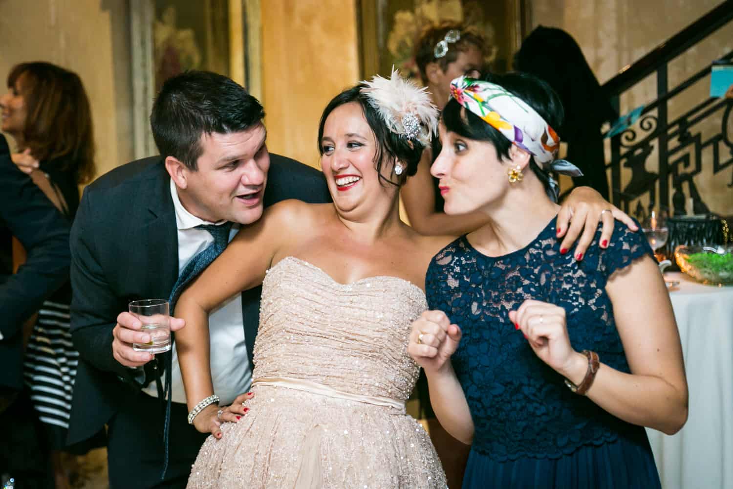 Bride surrounded by two guests at a 632 on Hudson wedding