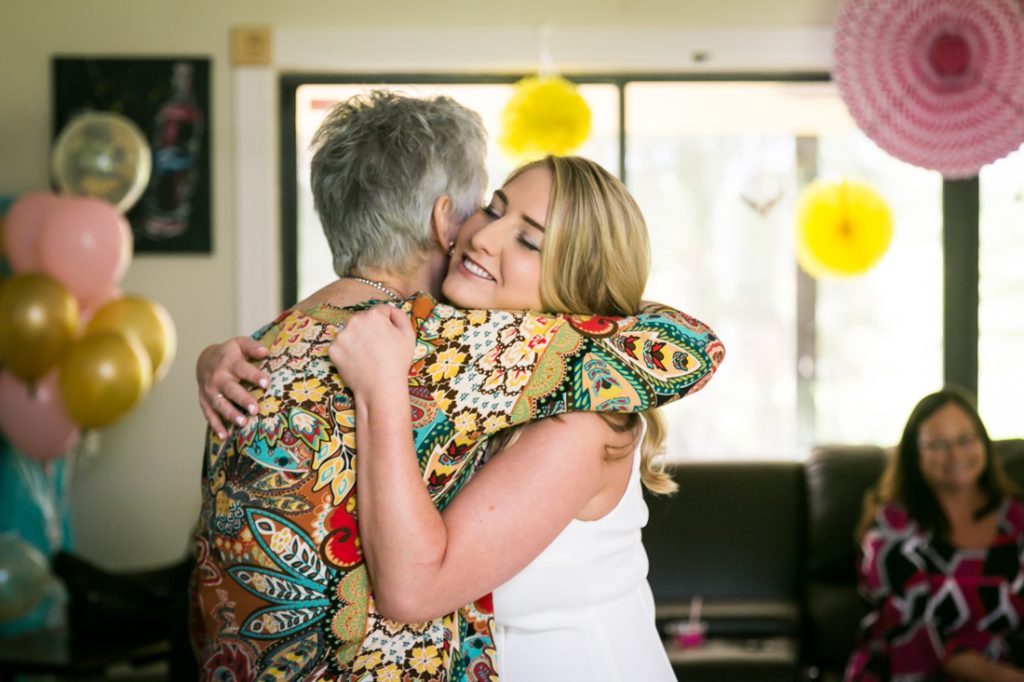 Bride-to-be hugging grandmother at a Florida bridal shower