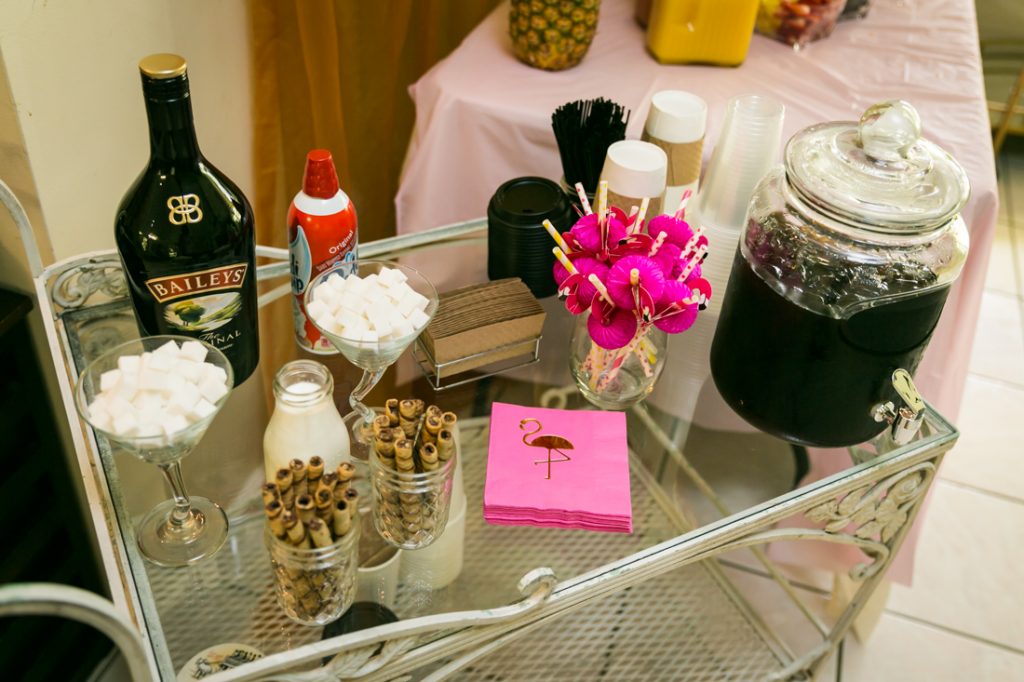 Coffee bar with marshmallows, liquor, and pink napkins