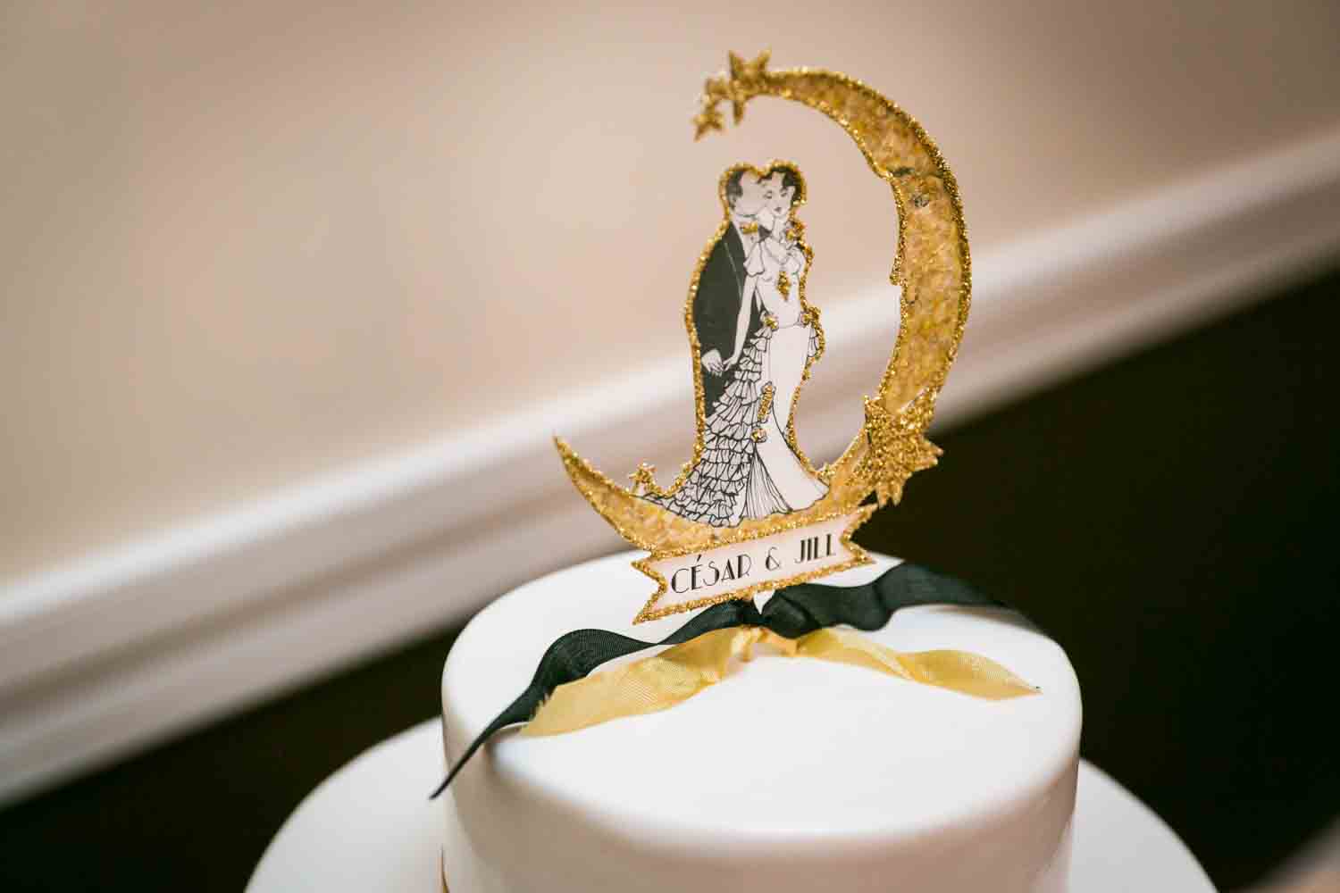 1920s theme wedding cake topper with moon and bride and groom