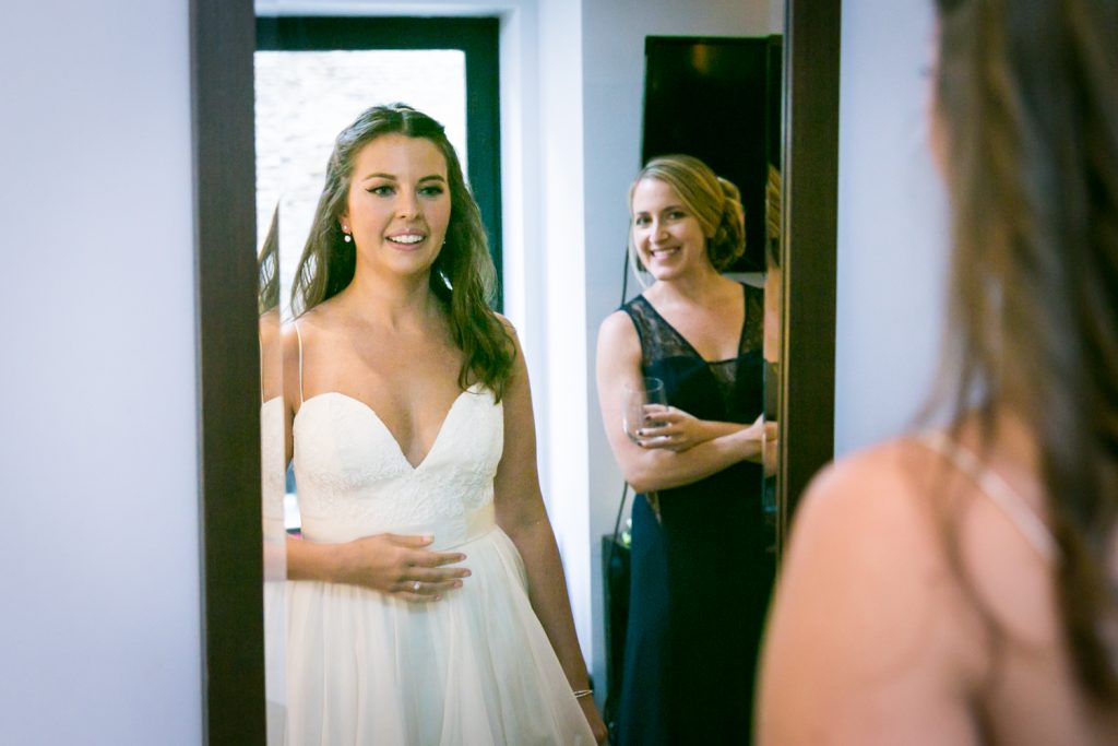 Bride looking in mirror before her Bathhouse Studios wedding