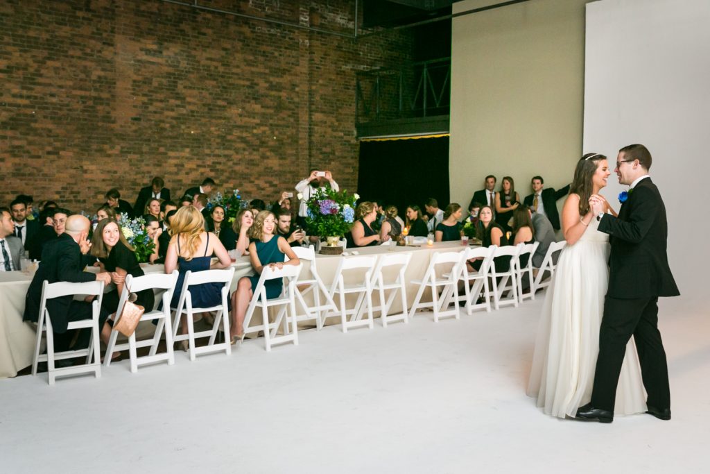 Bride and groom dancing in front of guests at Bathhouse Studios wedding reception