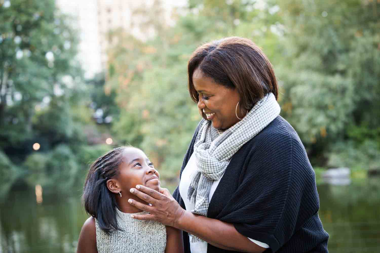Central Park fall family portrait of mother touching daughter's face