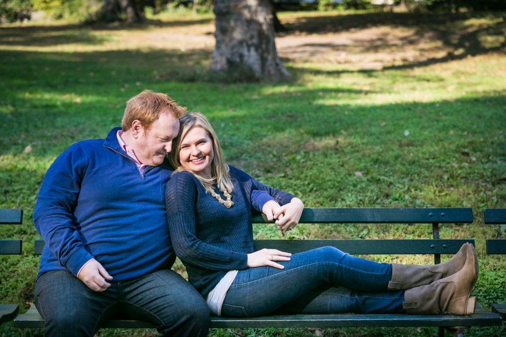 Central Park family photos of couple sitting on bench