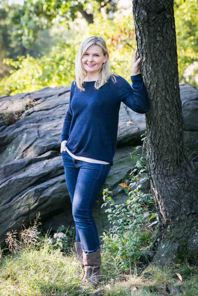 Central Park family photos of woman standing by tree