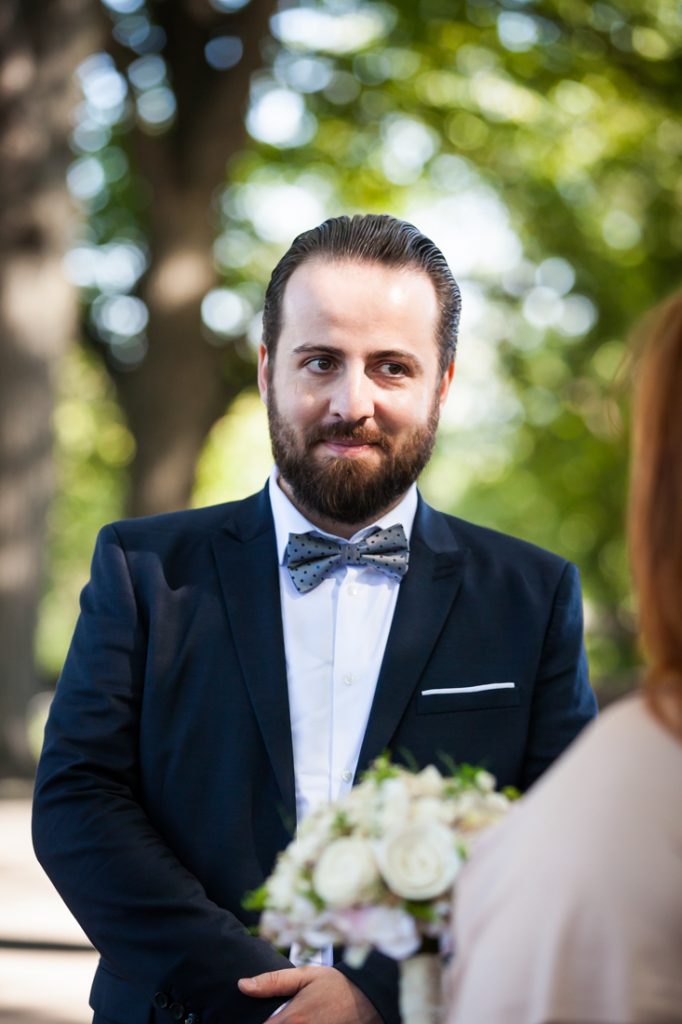 Groom looking at bride during ceremony for an article on how to plan a destination wedding