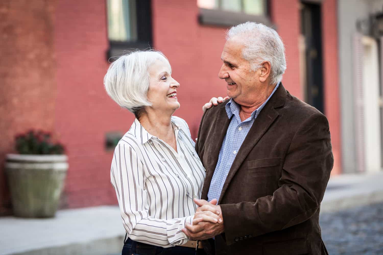 Photojournalistic portraits of older couple dancing in Washington Mews