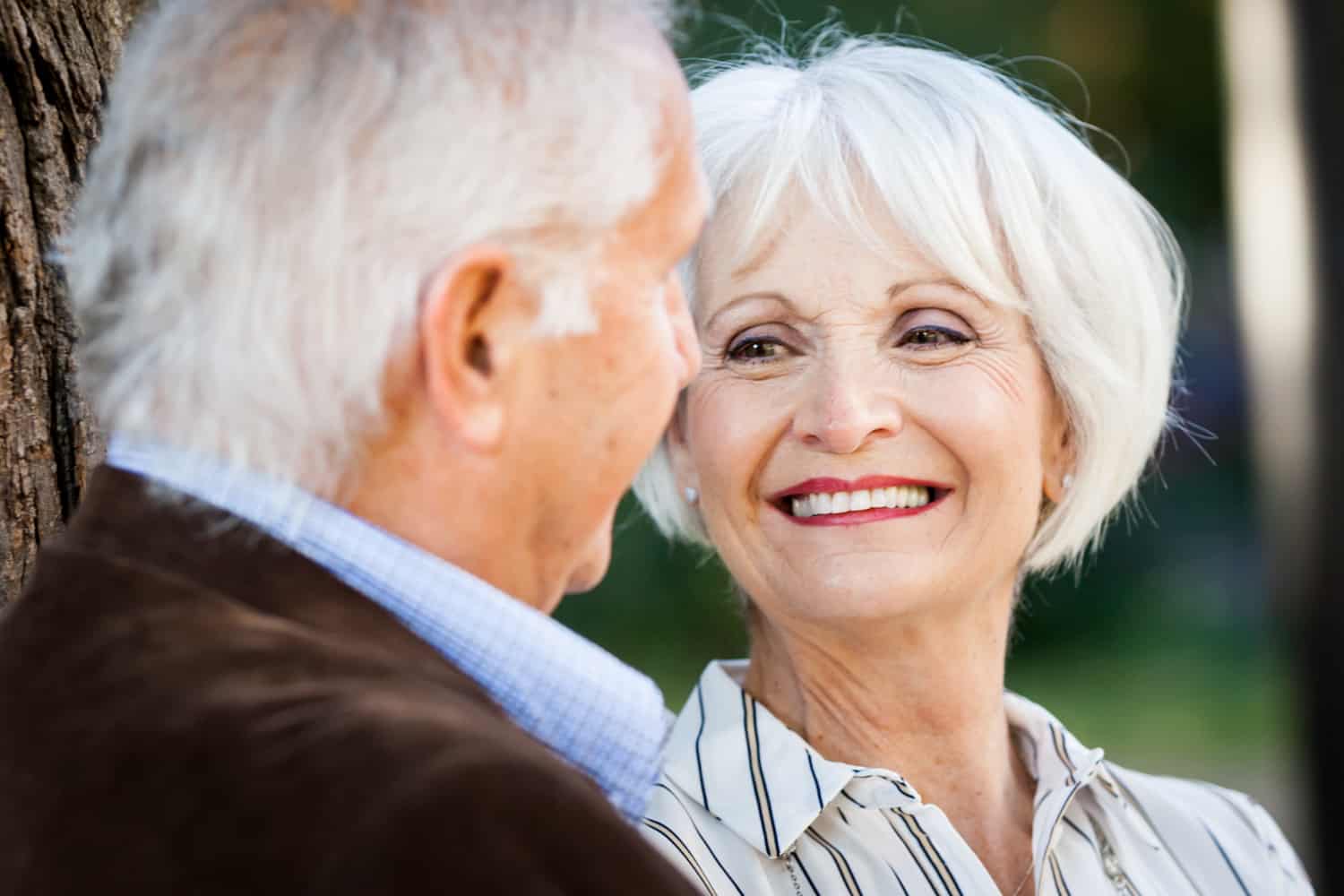Older woman looking at man and laughing