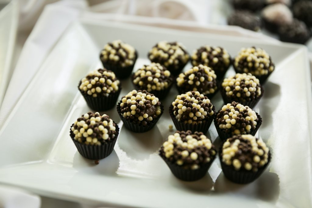 Mini chocolate covered in brown and white sugar beads 