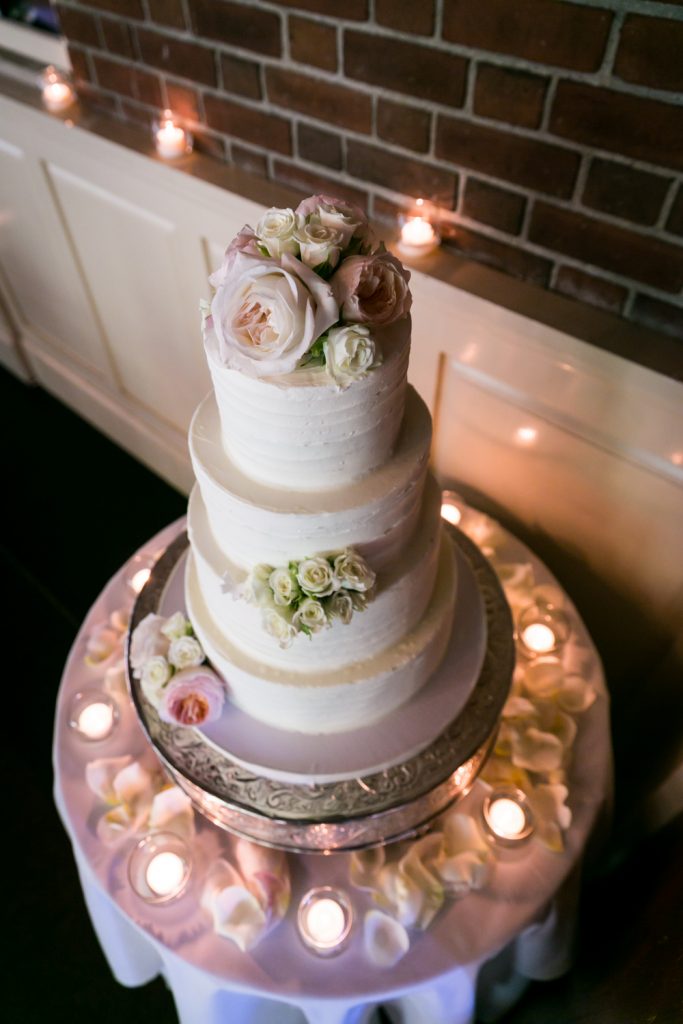 Four layer wedding cake with flowers